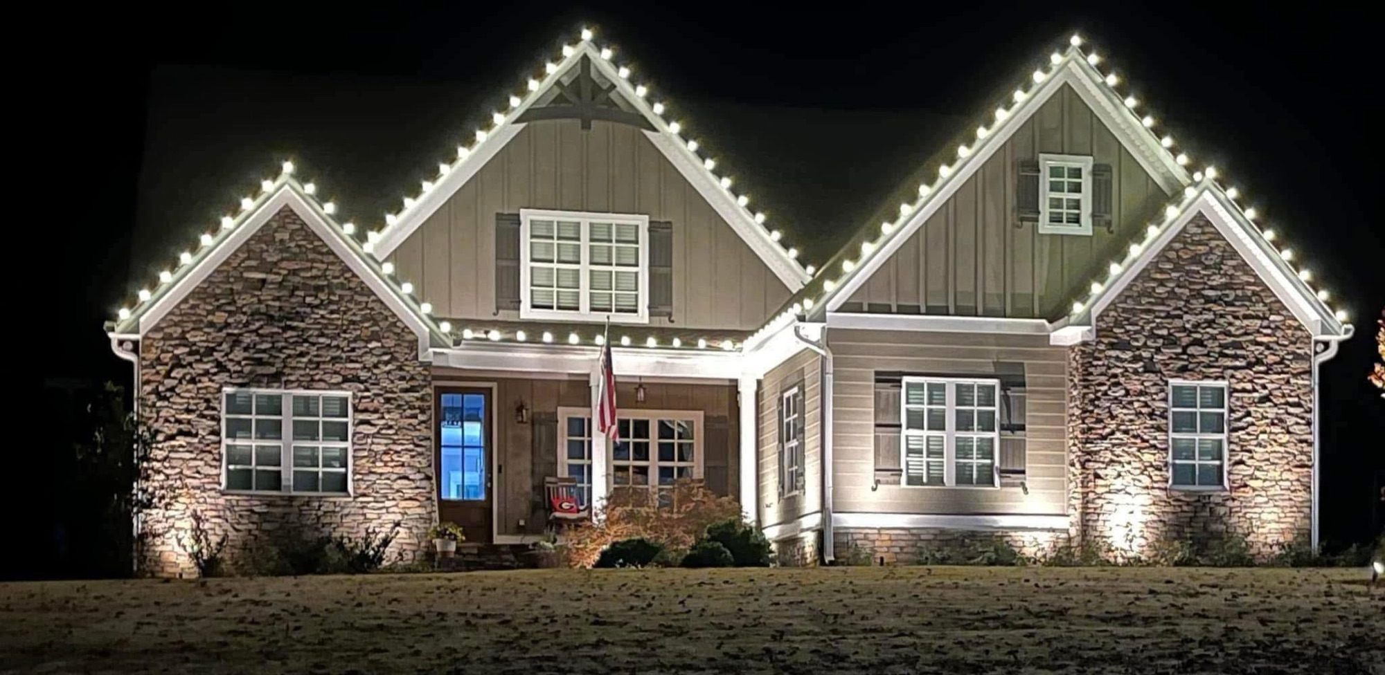 Warm white custom Christmas lights installed on a West Georgia home